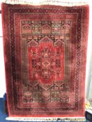 A Persian wool & silk carpet, 2265mm x 1575mm