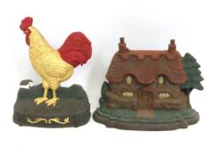 Two cast iron door stops, the cock measuring 266mm