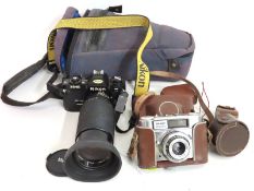 A Nikon FG-20 35mm film camera with Vivitar 35-200