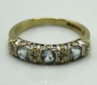 A 9ct gold ring set with small diamonds & possibly