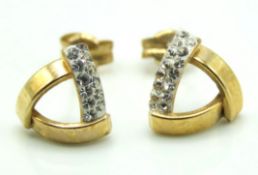 A pair of 9ct gold earrings set with white paste s