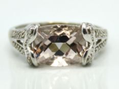 A 9ct white gold ring set with morganite & twelve
