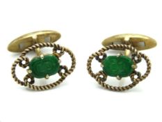 A pair of silver gilt mounted carved jade cufflink