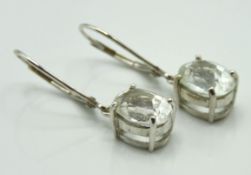 A pair of 9ct white gold earrings set with white t