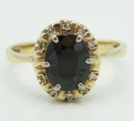 A 9ct gold ring set with sapphire & small diamonds