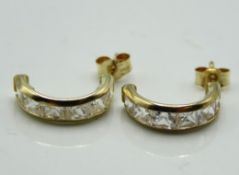 A pair of 9ct gold half hoop post fit earrings set