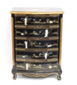 A Chinese lacquerware chest of drawers with gildin