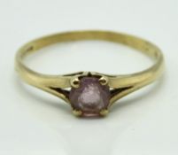 A 9ct gold ring set with amethyst, some abrading,