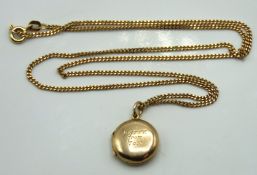 A 9ct gold chain with locket inscribed 