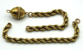 An antique yellow metal part of watch chain, tests