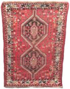 A Persian woollen Shiraz rug, 1450mm x 1080mm