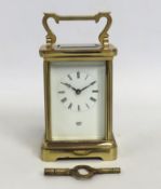 A Dent of London brass carriage clock with key, 15