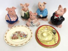 Five Net West pigs twinned with a Doulton Bunnykin