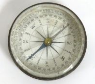 A small brass compass, 50mm diameter