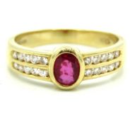 An 18ct gold ring set with ruby & approx. 0.2ct of