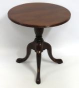 A low level mahogany lamp table, 518mm high x 500m