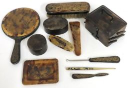 An early 20thC. Chinese tortoiseshell dressing tab