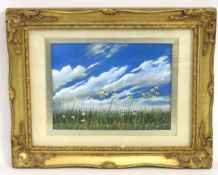 A framed unsigned oil of meadow against blue sky,