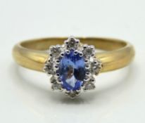 A 9ct gold ring set with tanzanite & approx. 0.08c