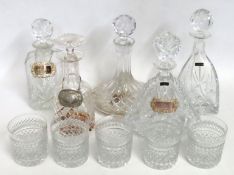 A selection of crystal decanters, some with labels