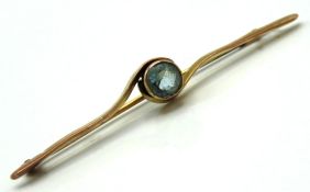 A 9ct gold bar brooch set with possibly aquamarine
