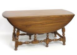 A low level Ercol Old Colonial drop leaf coffee ta