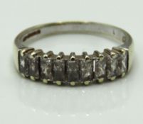 A 9ct gold ring set with baguette cut CZ stones, 2