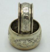 An 1898 Birmingham silver napkin ring with floral