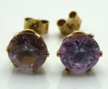 A pair of 9ct gold amethyst set post fit earrings,