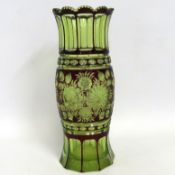 An antique Bohemian overlay glass vase, chipped to