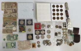 An album of British pennies, a Roman coin circa AD