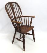 An 18thC. elm seated Windsor chair, faults: repair