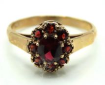 A 9ct gold garnet cluster ring, 2.5g, size L
