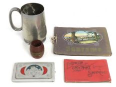 A Chinese pewter tankard with dragon decor, twinne