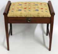 A mahogany music stool with lift up top sheet stor