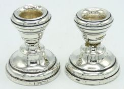 A pair of 1928 Birmingham silver candle holders by