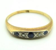 An antique 18ct gold ring set with sapphire & diam