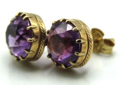 A pair of 9ct gold mounted amethyst post fitting e