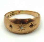 A 9ct rose gold ring set with single diamond chip,