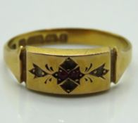 An antique 15ct gold ring set with two small rubie