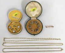 A cased set of Edwardian waistcoat buttons themed