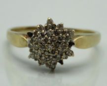 A 9ct gold diamond cluster ring lacking three ston