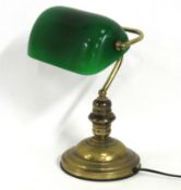 A traditional brass student desk lamp with overlay