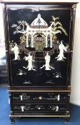 A two piece Chinese lacquerware cabinet with gildi