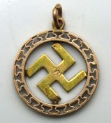 An early 20thC. 9ct gold good luck swastika symbol