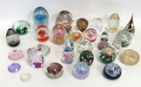 A collection of paperweights including larger 