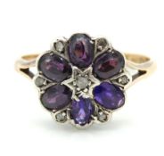 A 9ct gold ring set with amethyst & diamond of flo