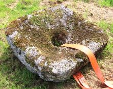 A bullaun style shaped granite stone with central hole, 900mm x 900mm x 300mm deep, no public viewin