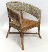 An early 20thC. child's cane & wicker musical chai