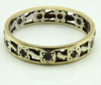 A 9ct two colour gold eternity ring set with white